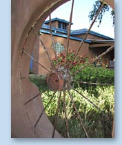 Photograph of building through wheel