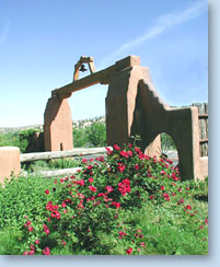 Photo of arch and nearby flowers