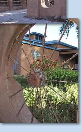 Photo of building and flowers through a wheel