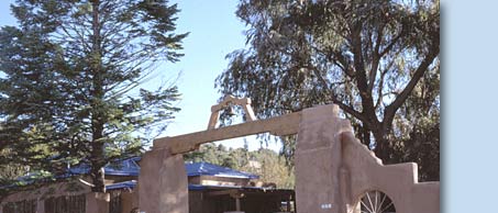 Photo of archway with wheels embedded in wall